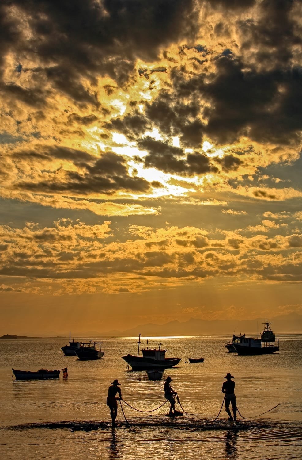 praia-da-armacao-buzios-Brazil Family on leisure travel watching sunset over praia da armacao in the beautiful typical brazilian city of buzios near rio de janeiro in brazil