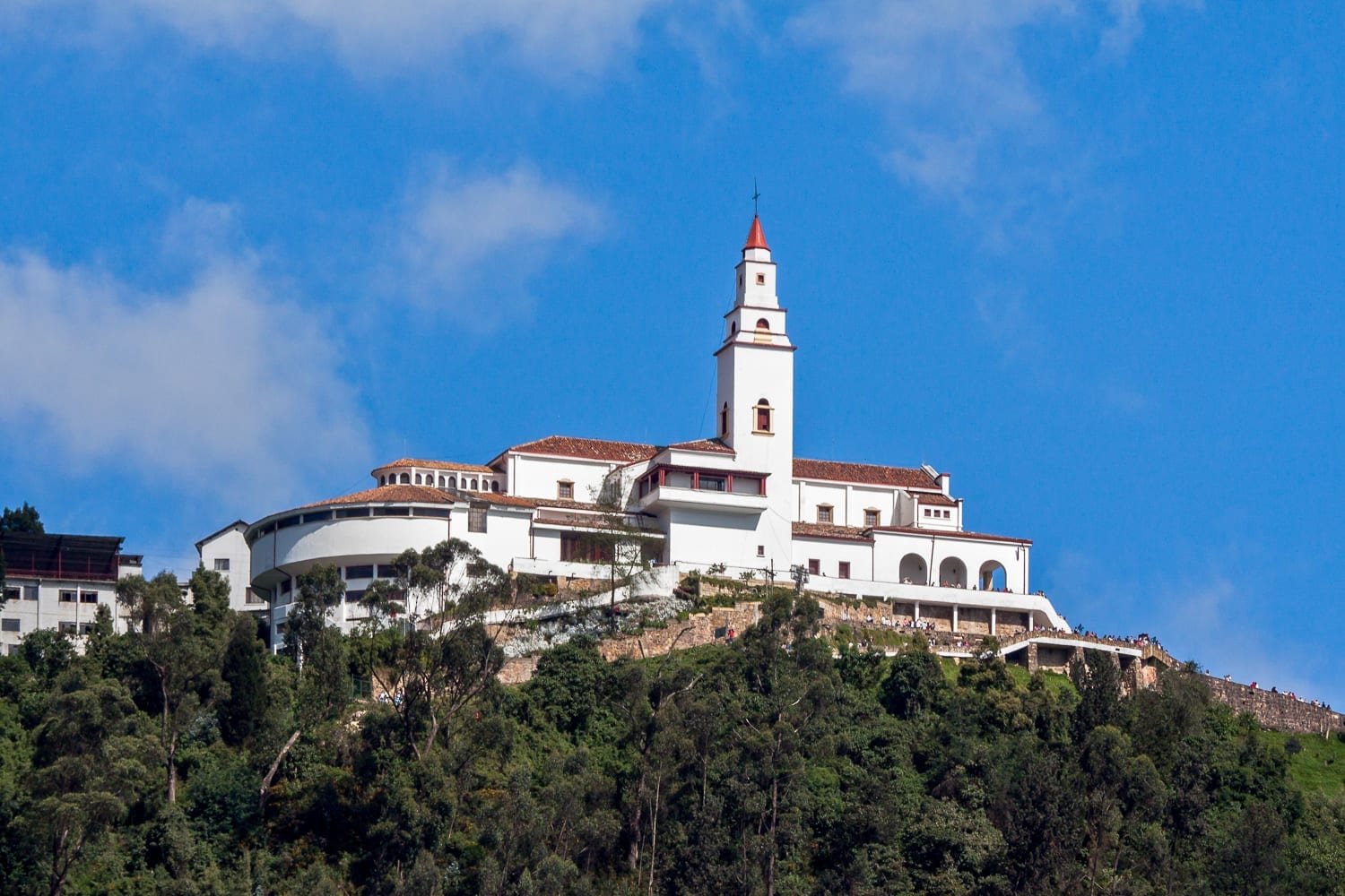 Colombia-Travel-Bogota-Monseratte White and orange church on the peak of Monseratte mountain, in the heart of Bogata, Columbia