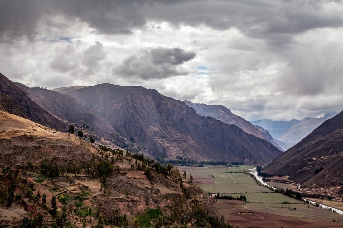 Peru-Travel-Sacred-Valley-Wide-View A wide angle shot of the clouds hovering over the mountains of the sacred valley in Peru