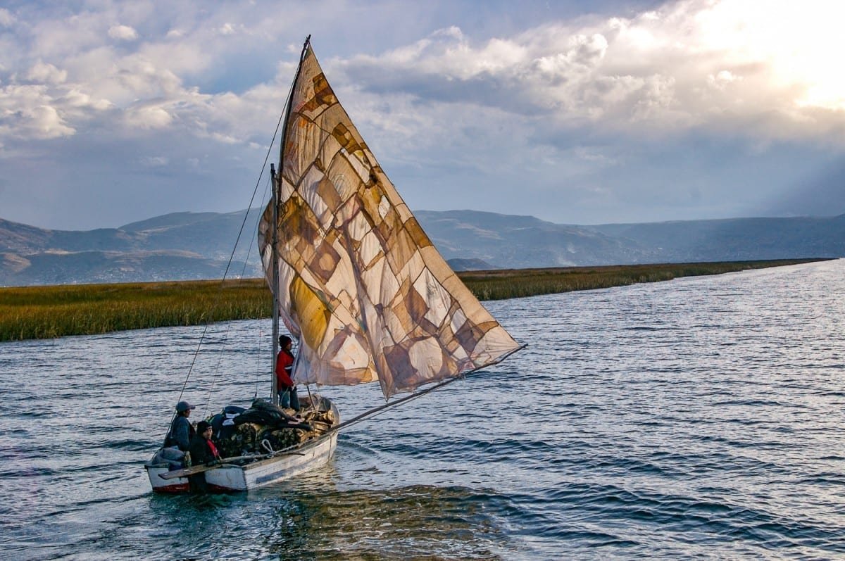 Peru-Vacation-Travel-Lake-Titicaca-Boat-Sail-DT Small sailboat navigating lake titicaca in Peru