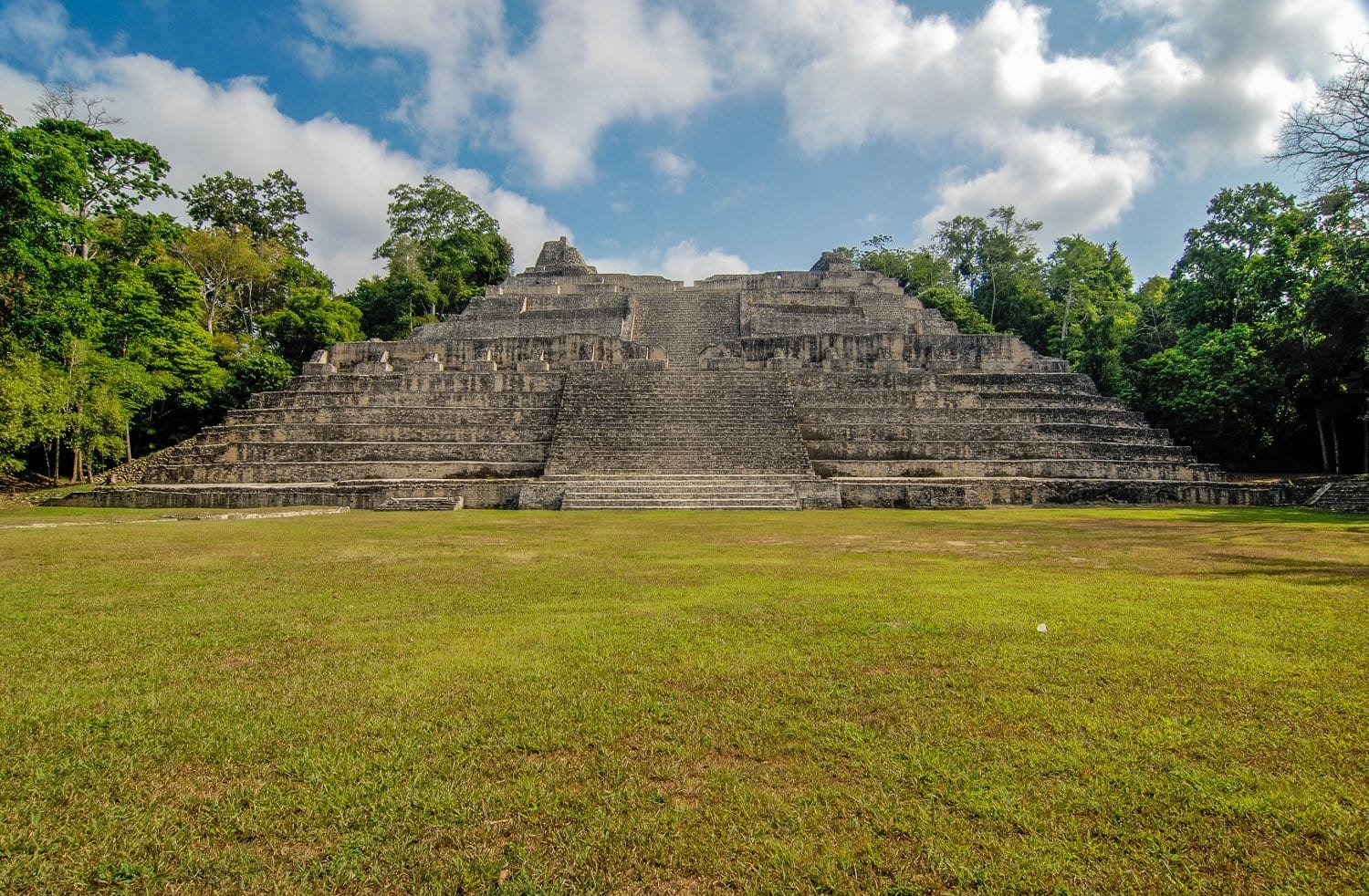 Belize-Private-Custom-Travel-Design-Caracol-2 A pyramid at Caracol, a large ancient Maya archaeological site, photographed on a family vacation tour of the ruins