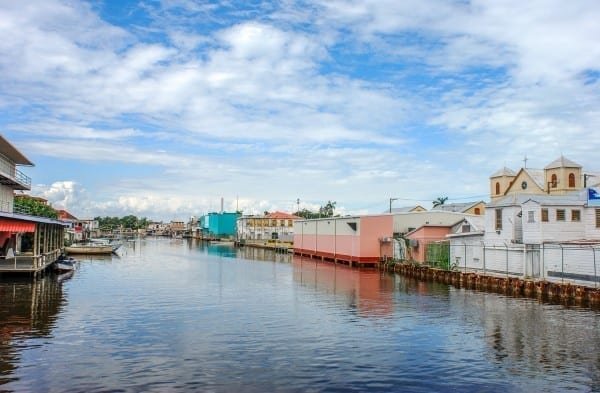 Belize-City-Canal The canal in the middle of Belize City, Belize, lined with pastel colored buildings and houses