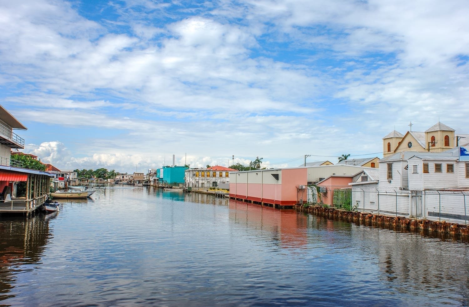 Belize-City-Canal The canal in the middle of Belize City, Belize, lined with pastel colored buildings and houses
