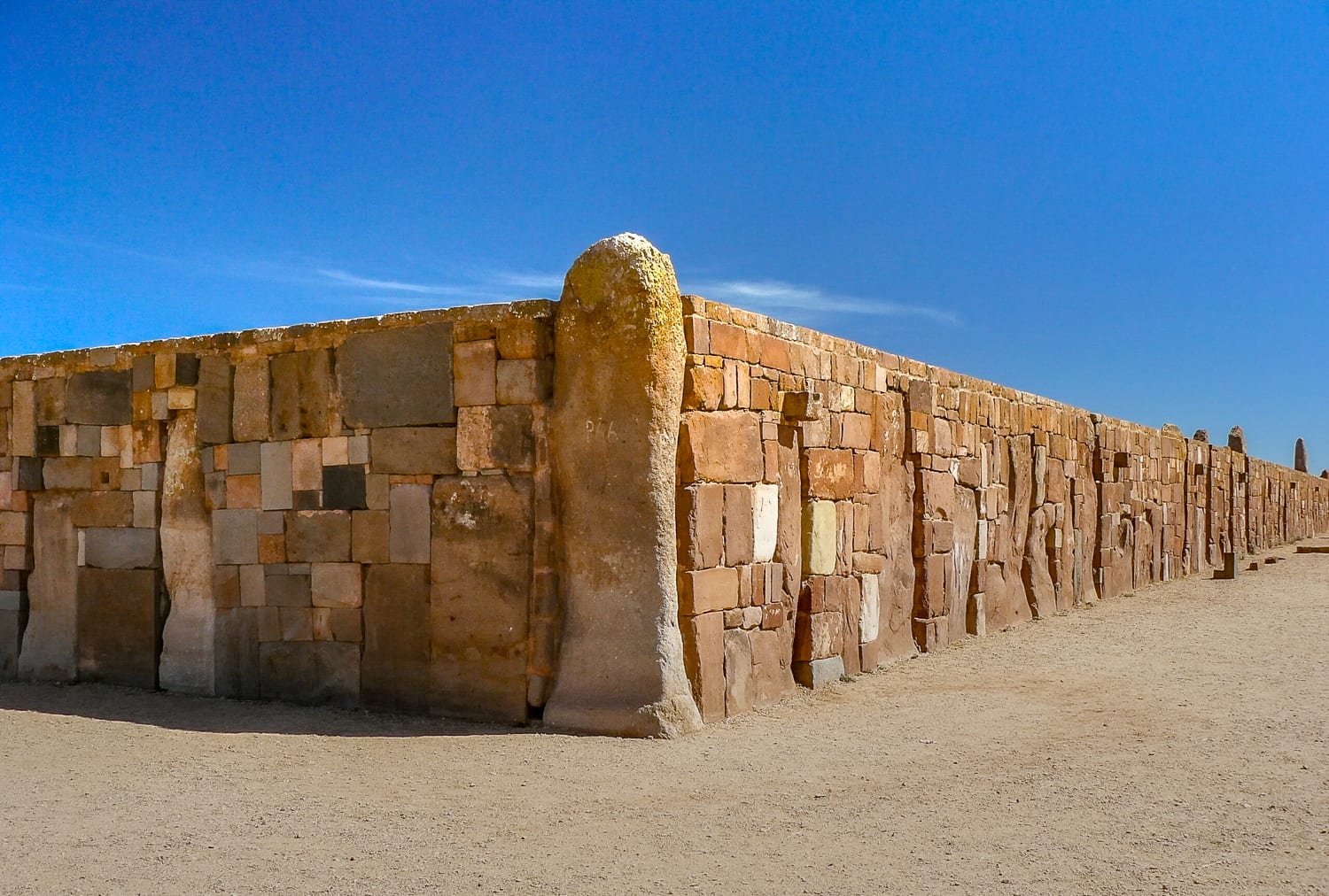 Tiwanaku-Wall-Ruins A red stone wall at the ancient Mayan ruins in Tiwanaku, photographed on a private tour