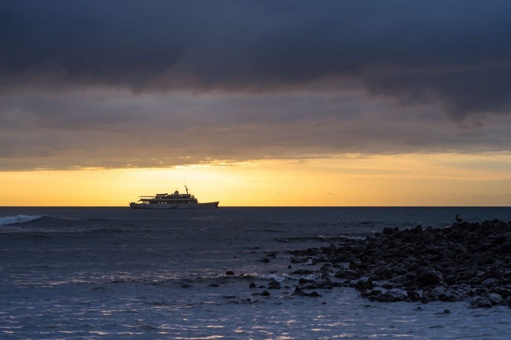 Grace-Silhouette Silhouette of the large, white Galapagos Charter Yacht, M/Y Grace, cruising the waters off the Galapagos Islands