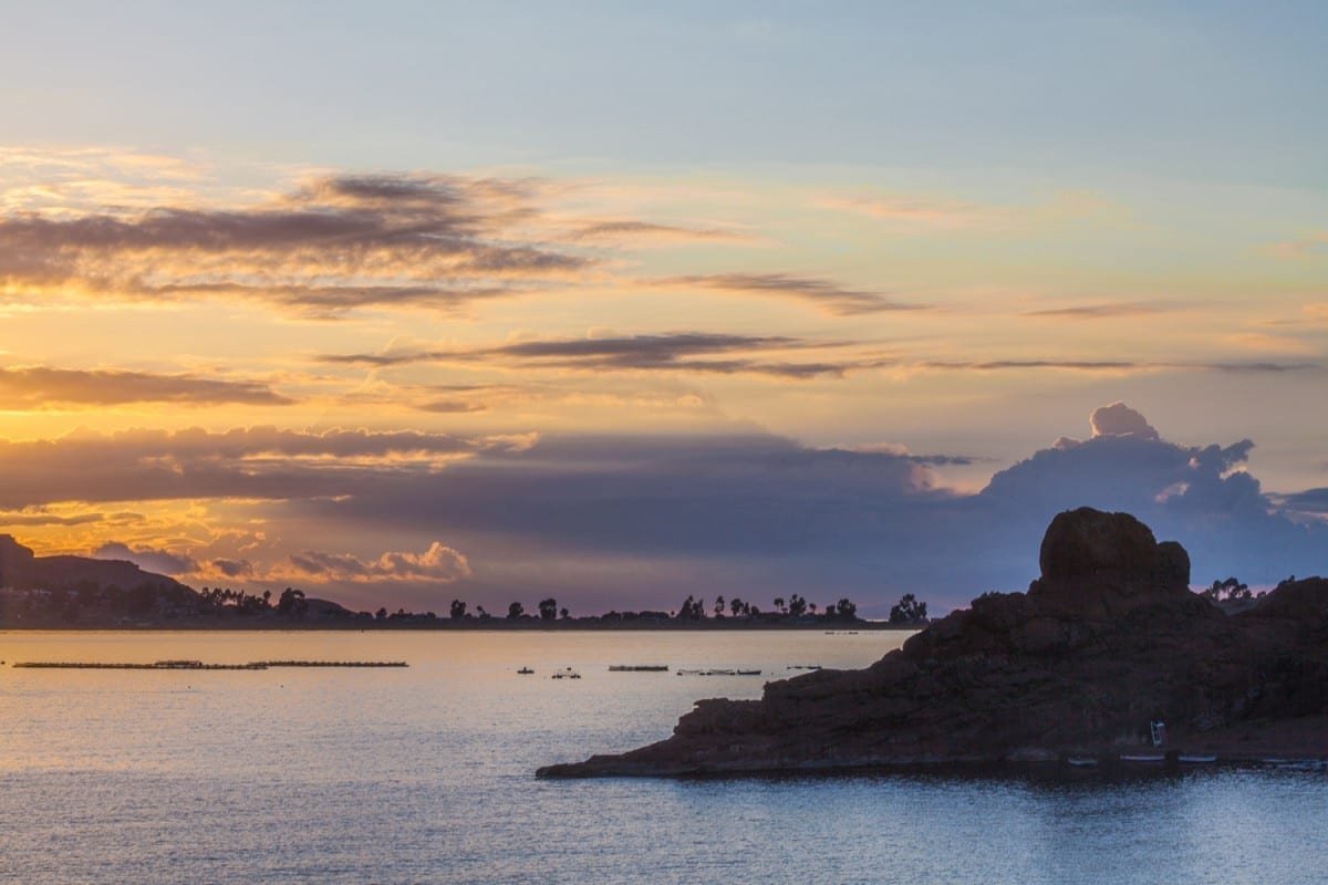 Lake-Titicaca-Peru-Landed-Travel-Private-Travel Sunset over a peninsula in Lake Titicaca, Peru