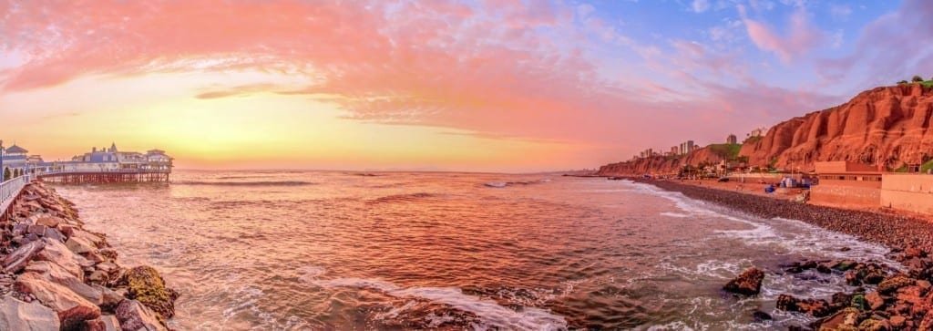 Landed-Travel-Private-Travel-Sunset-Ocean-La-Rosa-Nautica-Lima-Peru coral Sunset over beach in lima, peru photographed on vacation