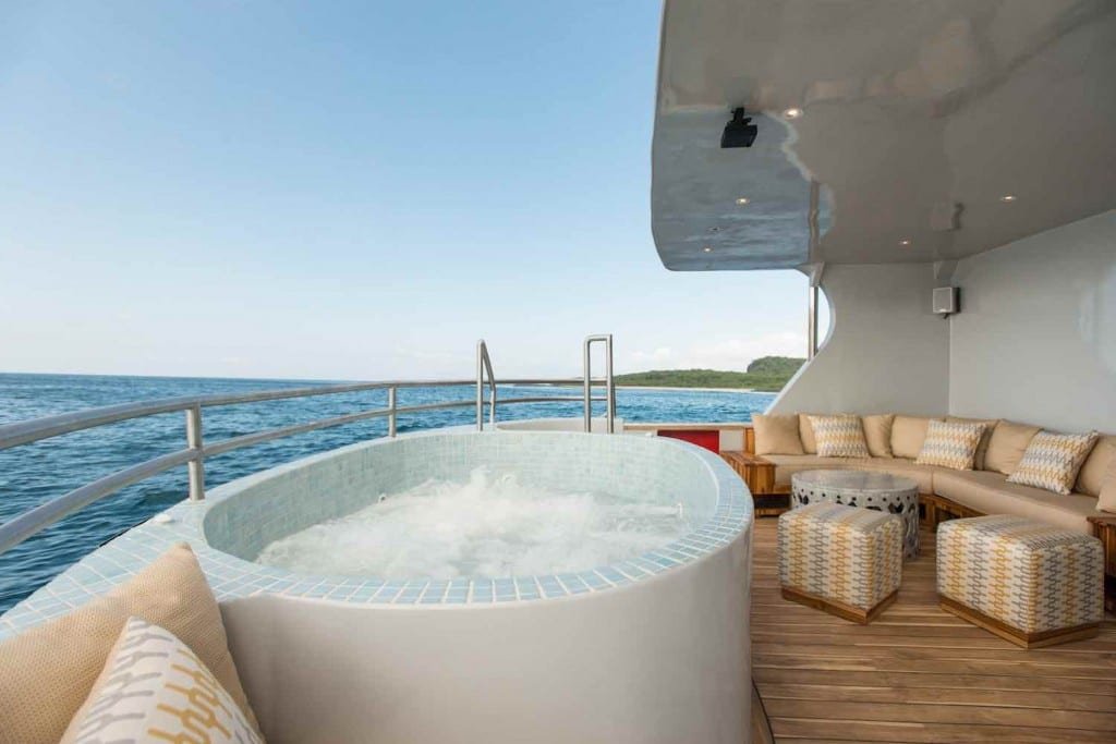 Origin-Galapagos-Yacht-Jaccuzzi Small white round hot tub on deck of Galapagos Charter Yacht M/V Origin
