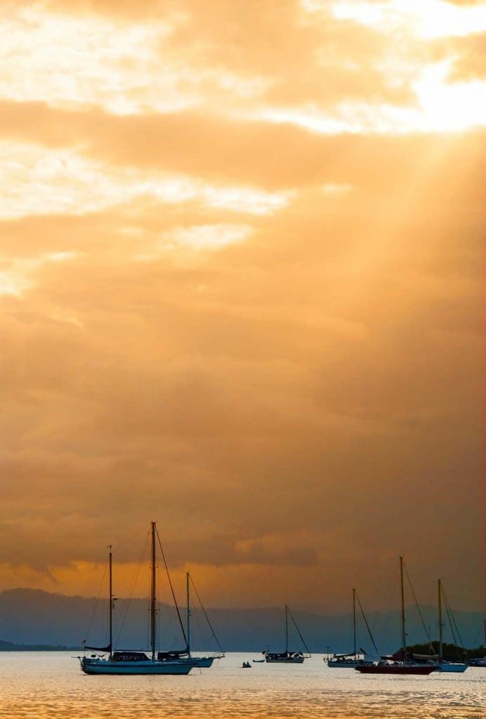 Pearl-Island-Sunset-Beach Some sail boats in a bay in panama, Backed by a beautiful orange sky off the shores of the Pearl Islands, Panama