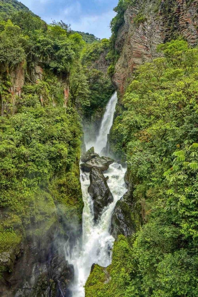 Private-Travel-Custom-Travel-Ecuador-Diablo-Waterfall El Diablo Waterfall near Banos, Ecuador. Large white waterfall pouring down steep green rock face