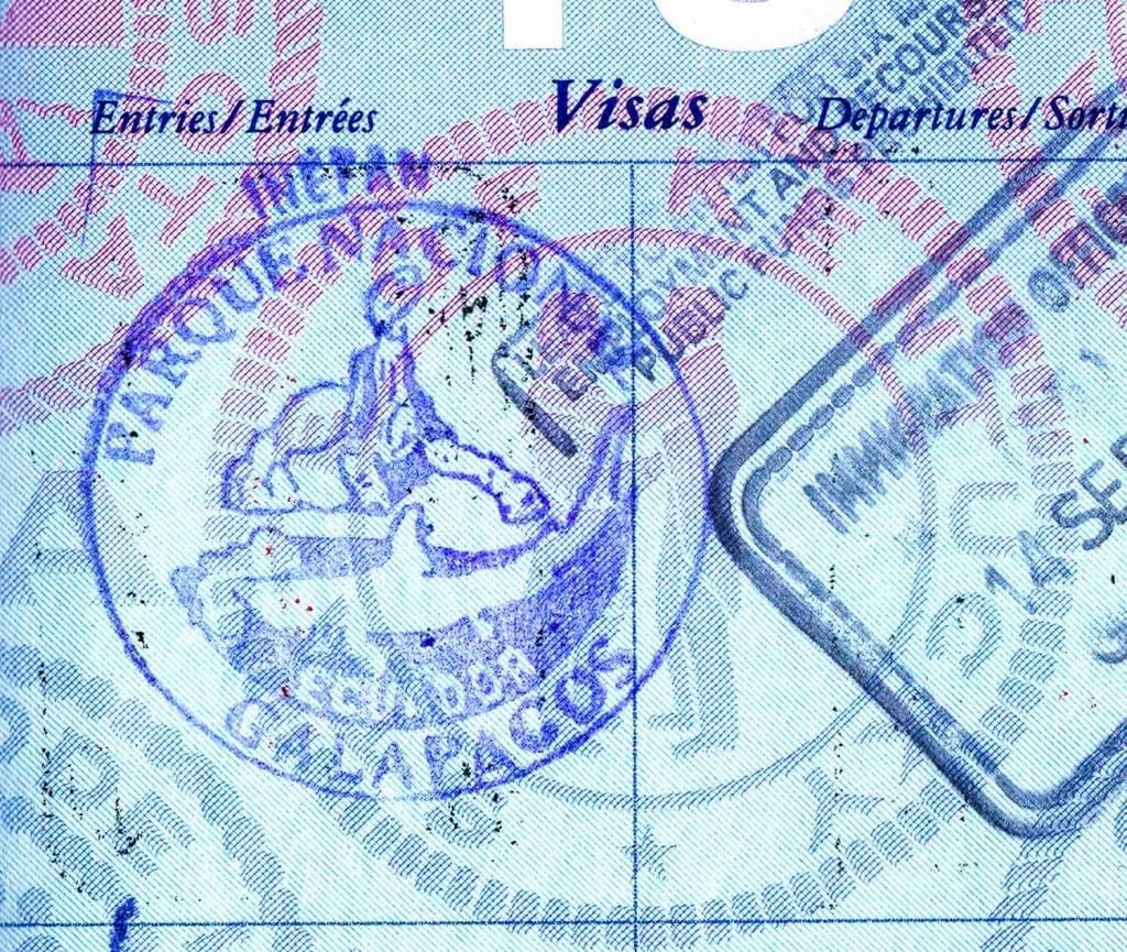 Travel-Ecuador-Galapagos-Passport-Stamp Galapagos Island passport stamp on blue page of US Passport showing a giant galapagos tortoise