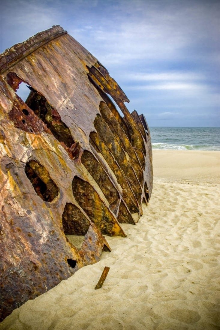 Private-Travel-Custom-Travel-La-Pedrera-Ship Skeletal remains of a brown ship on the Beach of La Pedera