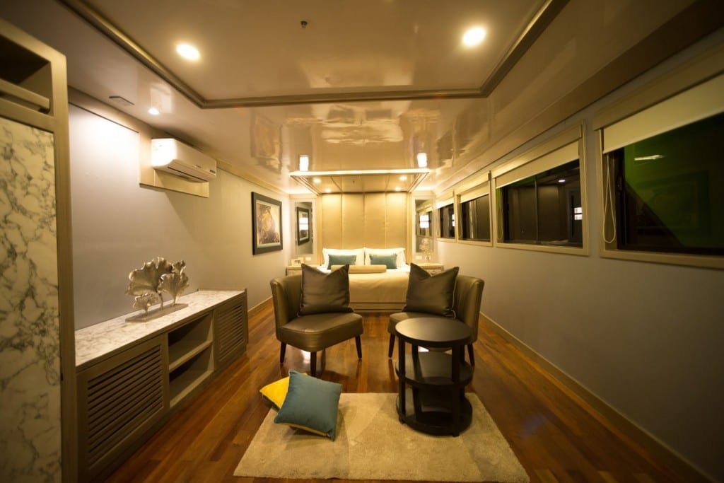 Sea-Star-suite-night-Galapagos View inside the large, Galapagos luxury charter Sea Star Suite showing powder mirror and large bed, onboard M/Y Sea Star