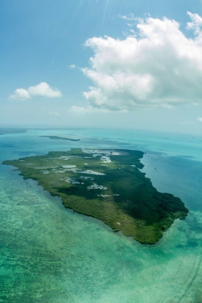 Belize-Private-Custom-Travel-Design-Ambergris-Caye-2 drone picture of a private island surrounded by crystal clear waters