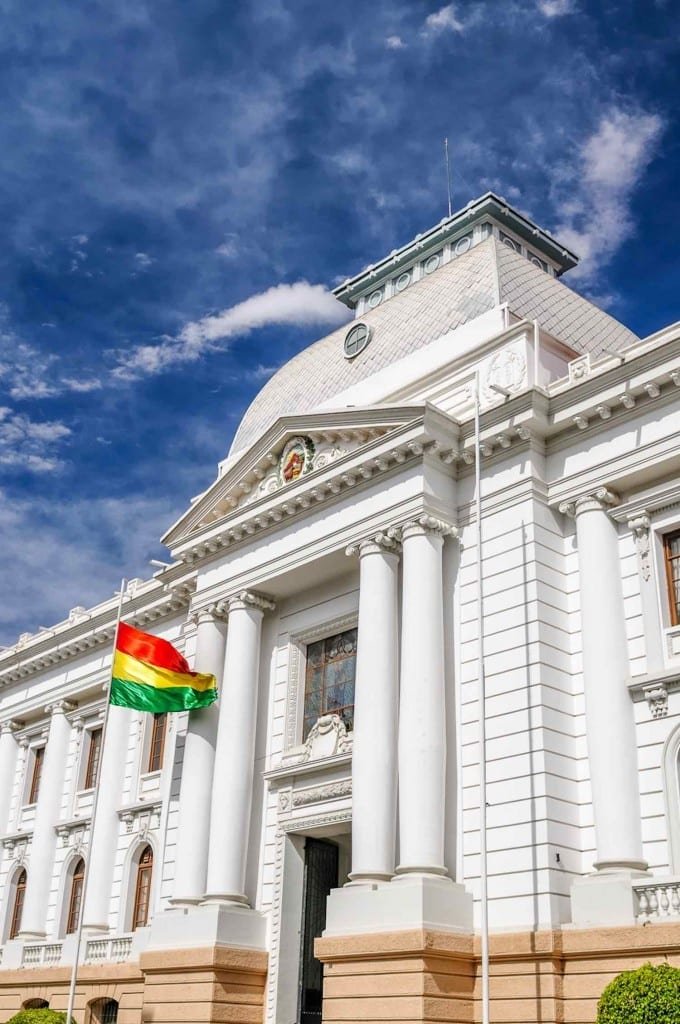 South America – Bolivia, Sucre Massive white Bolivian Parliament building in La Paz, flying the flag of Bolivia