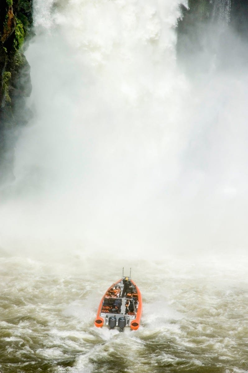Custom-Travel-Iguazu-Falls-Argentina-Great-Adventure A group of people on vacation, touring Iguazu Falls in Argentian, by boat