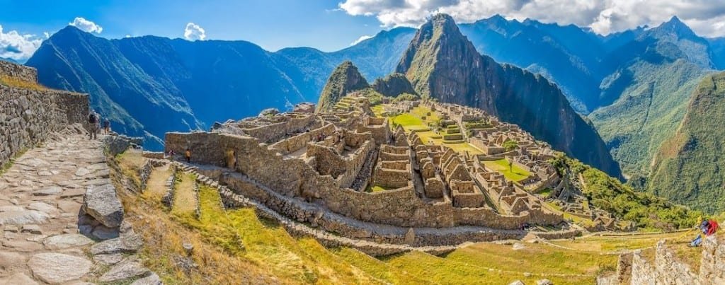 Custom-Travel-Vacation-Travel-Wide-Gold-Machu-Picchu Golden sunrise over the ancient Inca city of Machu Picchu