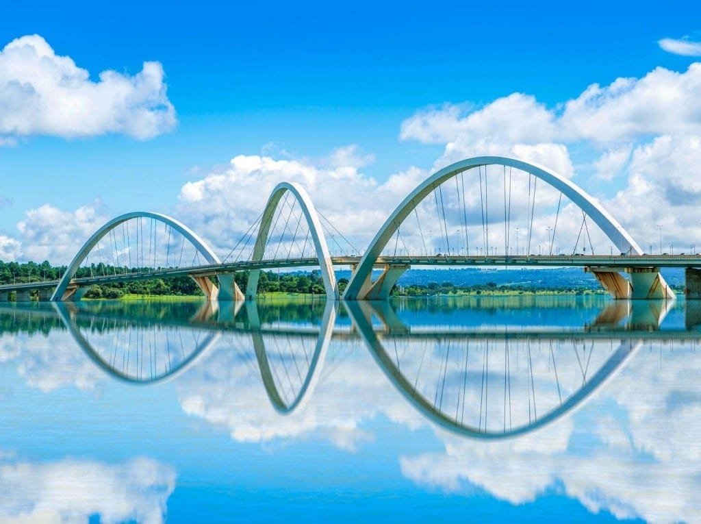 Landed-Travel-Private-Travel-Brasilia-JK-Bridge-Brazil (1) Unique JK bridge in Brasilia, Brazil. Suspension style with three large arches over mirror smooth water