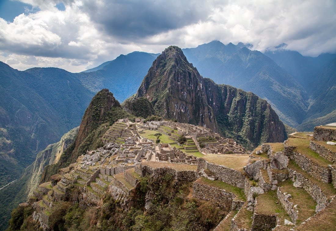 Private-Custom-Travel-Design-Machu-Picchu-Classic Landscape of Machu Picchu Ruins, showing light cloud cover overhead