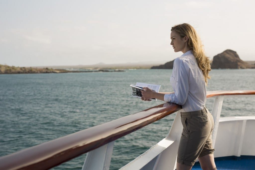 Yacht-Isabela-II-LIFE-STYLE-1 Woman looking over the side of Isabella II, Galapagos Charter Yacht