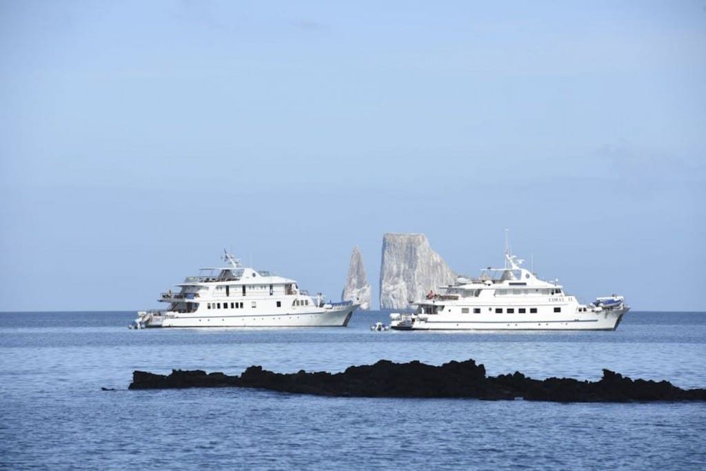 coral-galapagos-yachts Two comfortable Galapagos luxury yachts, off the shore of the archipelago on a cruise of the islands