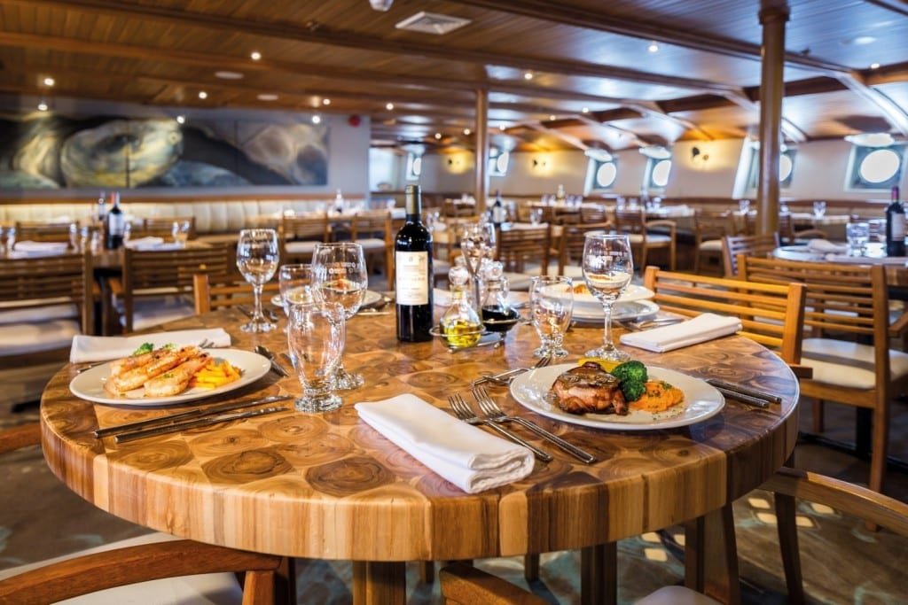 lonesomegeorgerestaurant3 table set for dinner Lonesome George restaurant on MV Legend Galapagos Cruise Ship