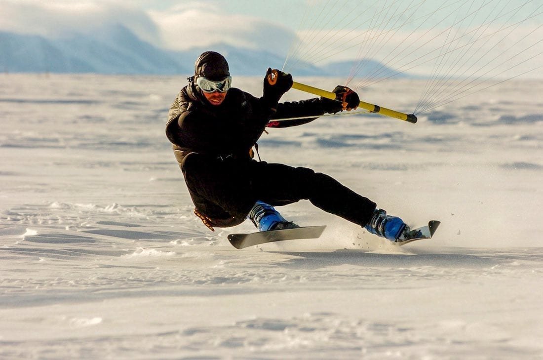 Antarctica-Private-Custom-Travel-Design-White-Desert-3 Man kite skiing at luxury Antarctic hotel Whichaway Camp