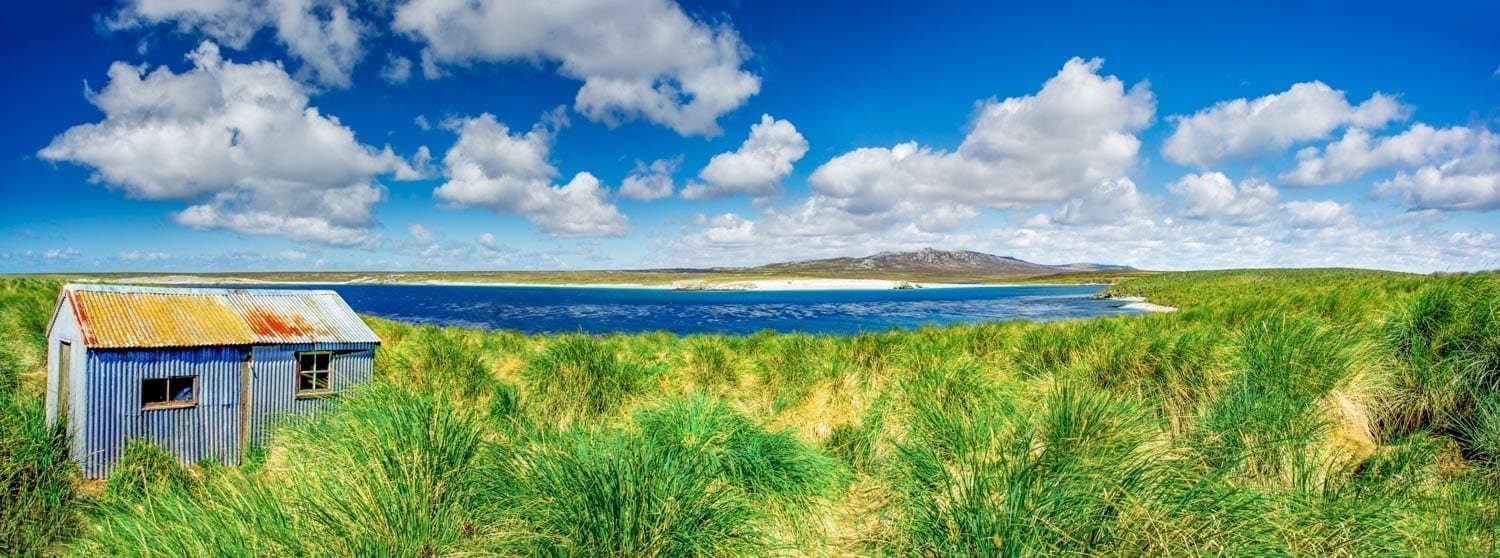 Landed-Travel-Private-Travel-Kidney-Island-Falklands-Antarctica Kidney Island in the Falkland Archipelago of Antarctica, photographed during an Antarctic cruise family vacation