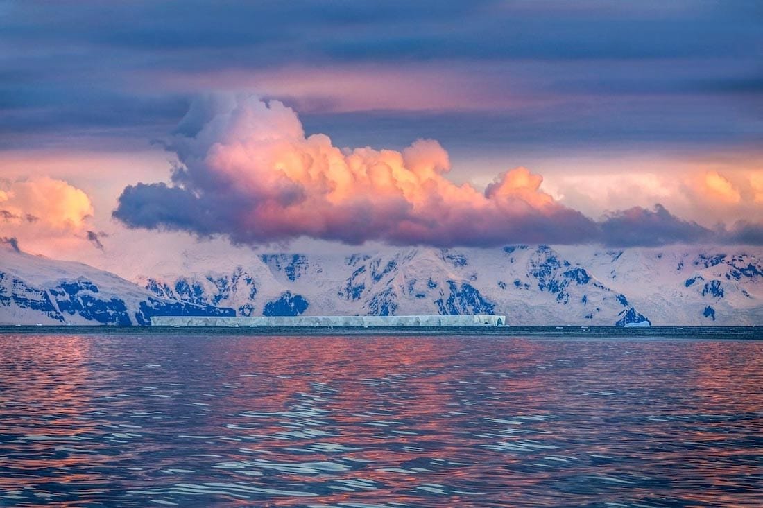 Flight-Antarctica-Travel-Tabular-Iceberg-Purple-Light-Antarctica Purple sunset over the Tabular Iceberg, photographed after a flight to Antarctica as part of an Antarctic expedition tour