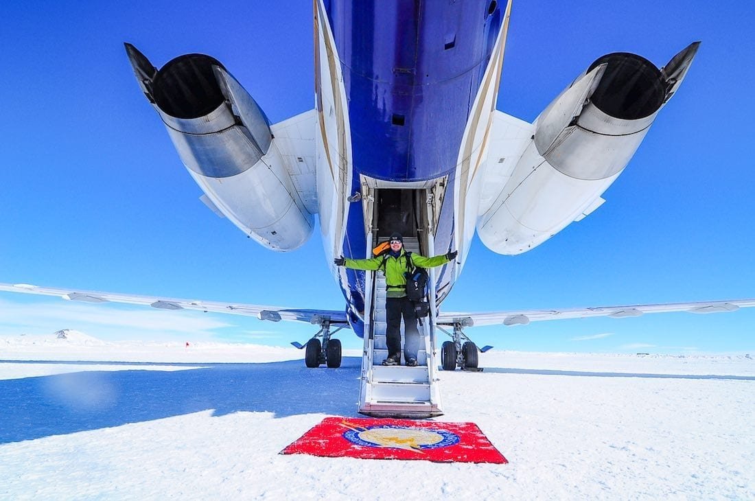 Private-Jet-Antarctica-Gulfstream-Luxury-Antarctic-Camp Man in green jacket de-planing private jet at Antarctic hotel Whichaway camp, a White Desert Property