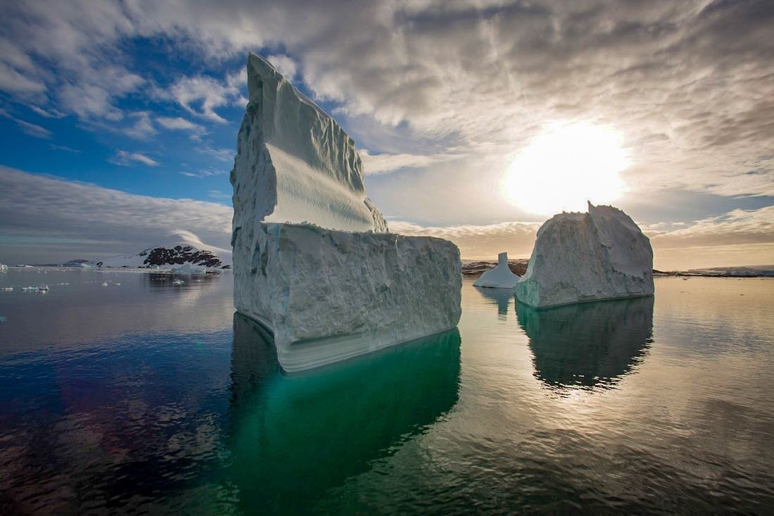 Passing a large iceberg entering Lemaire Channel, Antarctica Passing a large iceberg entering Lemaire Channel, Antarctica