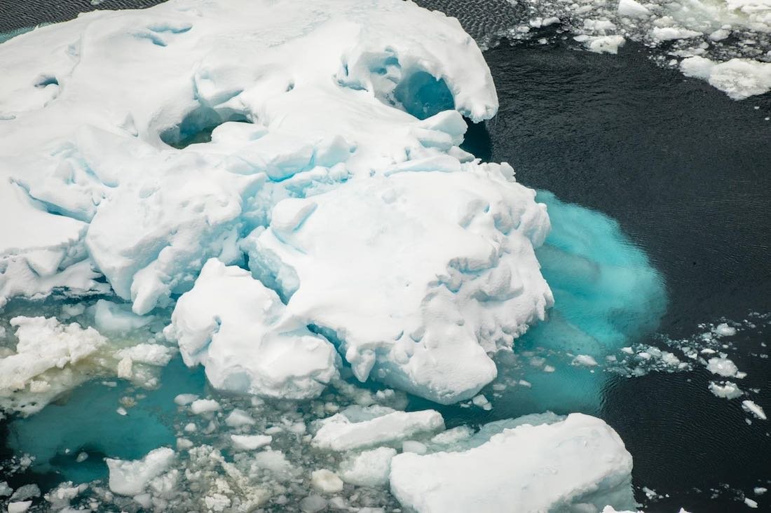 Antarctica-Travel-Guide-Ice-Ocean Aerial photo of snowy glacier in the Antarctic ocean
