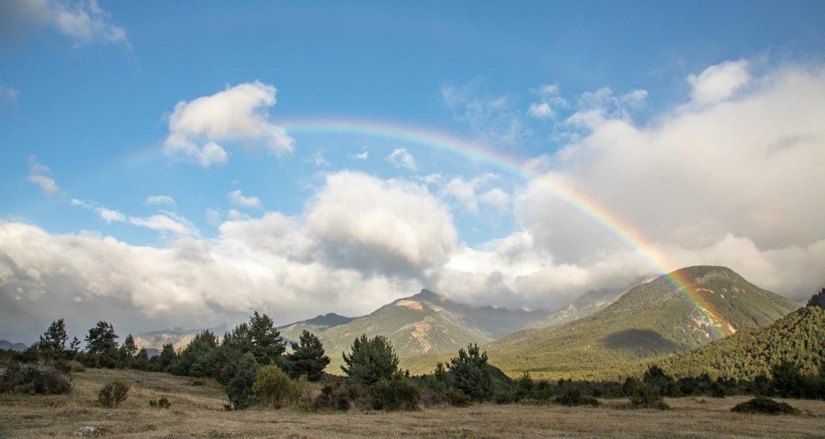 Corcovado-Private-Travel-Chile-Aysen-208 Rainbow over the green hills and legendary Corcovado Volcano in Corcovado Park in Chilean Patagonia