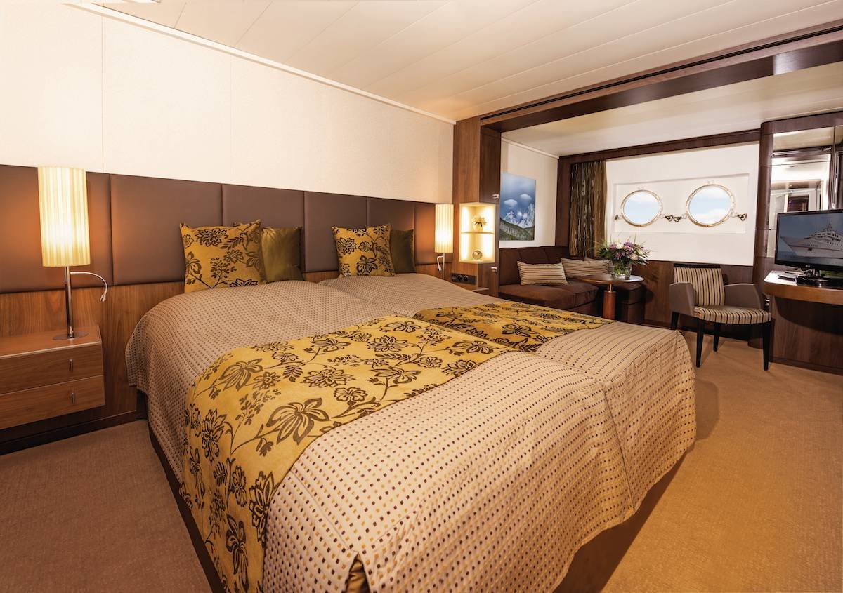 RCGS Resolute Triple Private The RCGS suite features two double beds and small windows looking out onto glaciers.