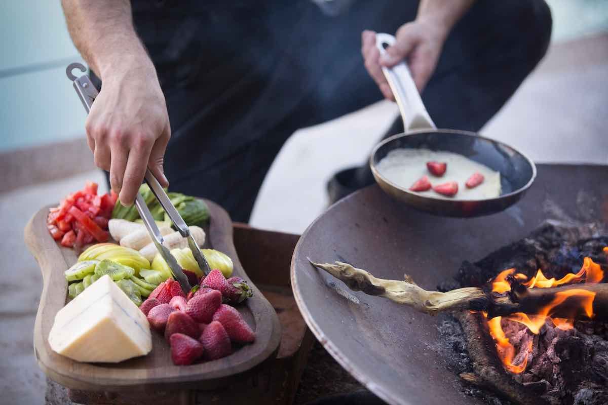 The-vines-fresh-fruit-skillet The vines breakfast and dessert includes fresh, seasonal fruite cooked in a skillet over a fire.