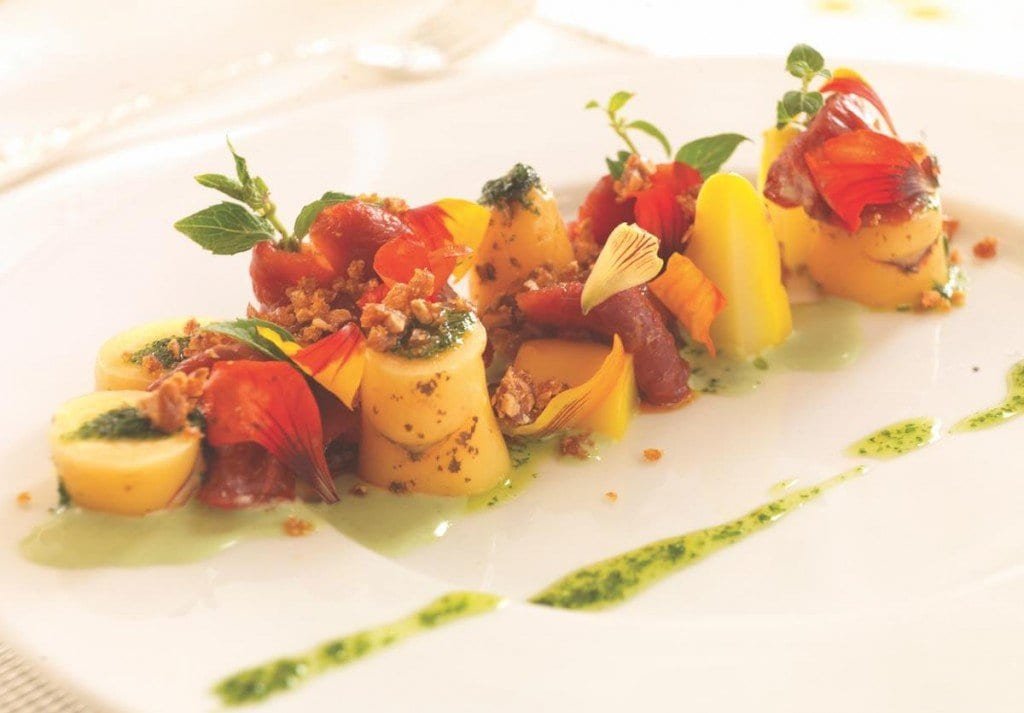 Belmond-Palacio-Nazarenas-Food-Adrian-Houston Belmond Palacio Nazarenas features a colorful plate of potatoes, meat, and fruit.