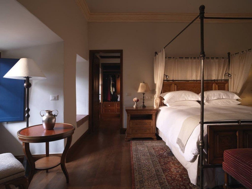 Belmond-Palacio-Nazarenas-One-Bedroom-Suite-Adrian-Houston The one bedroom suites at Belmond Palacio Nazarenas feature a king four poster bed, wood floors, rug and colonial furnishings.