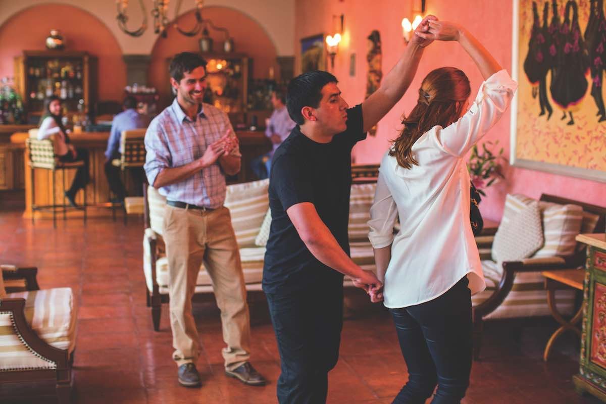 Belmond-Palacio-Nazarenas-Salsa-Matt-Hind Guests at the Palacio Nazarenas can enjoy salsa lessons as seen by a man and woman twirling each other while dancing.