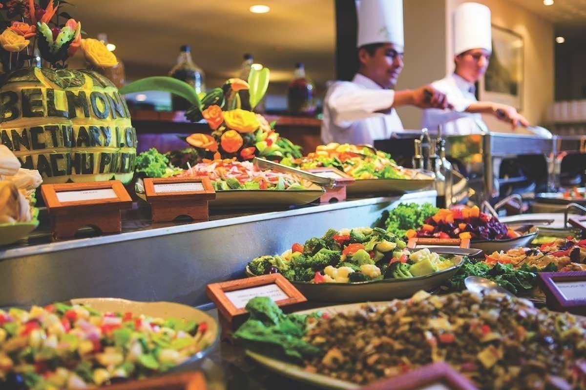 Belmond-Sanctuary-Food Belmond Sanctuary lodge offers a colorful buffet of food including a variety of meats, veggies and desserts.
