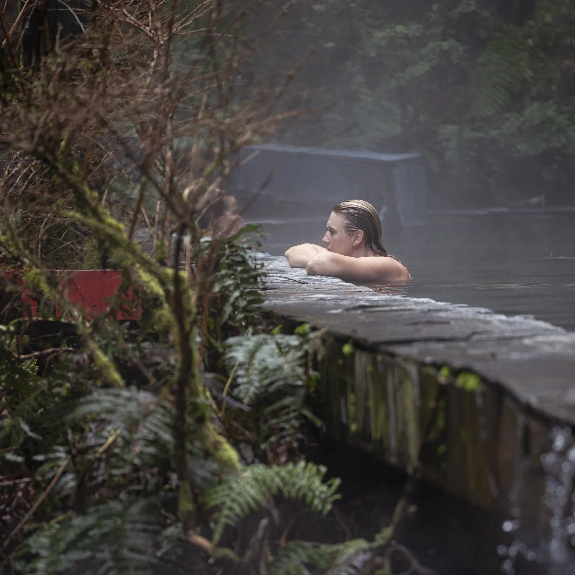 A floating meditation in the natural pool with a forest view of Pucon, Chile