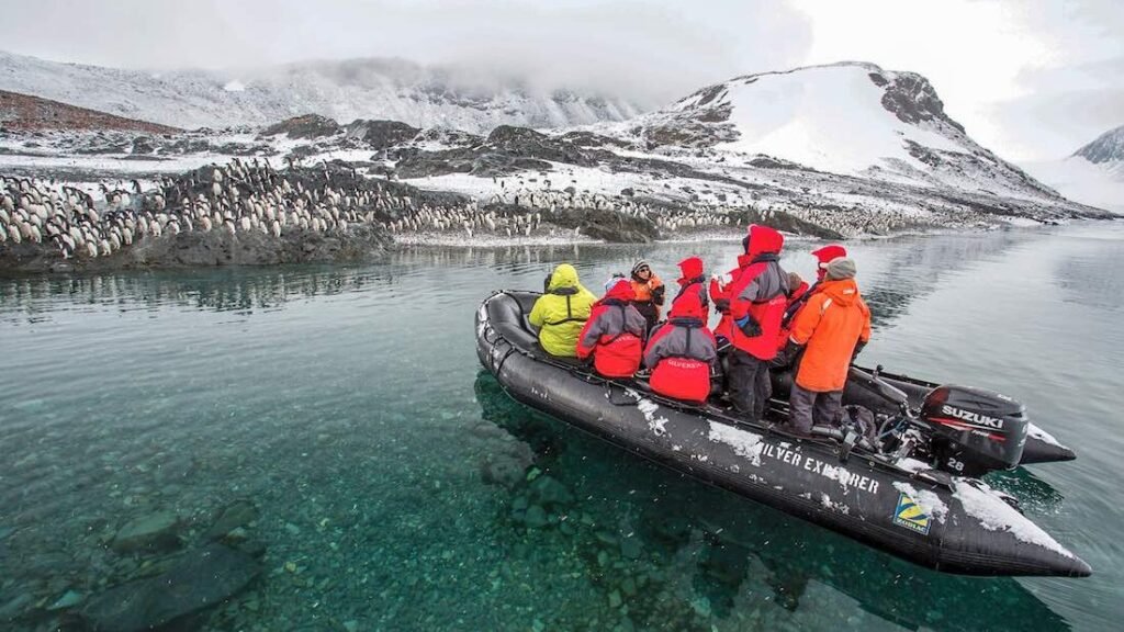 Travelers zodiac cruising in Antarctica.