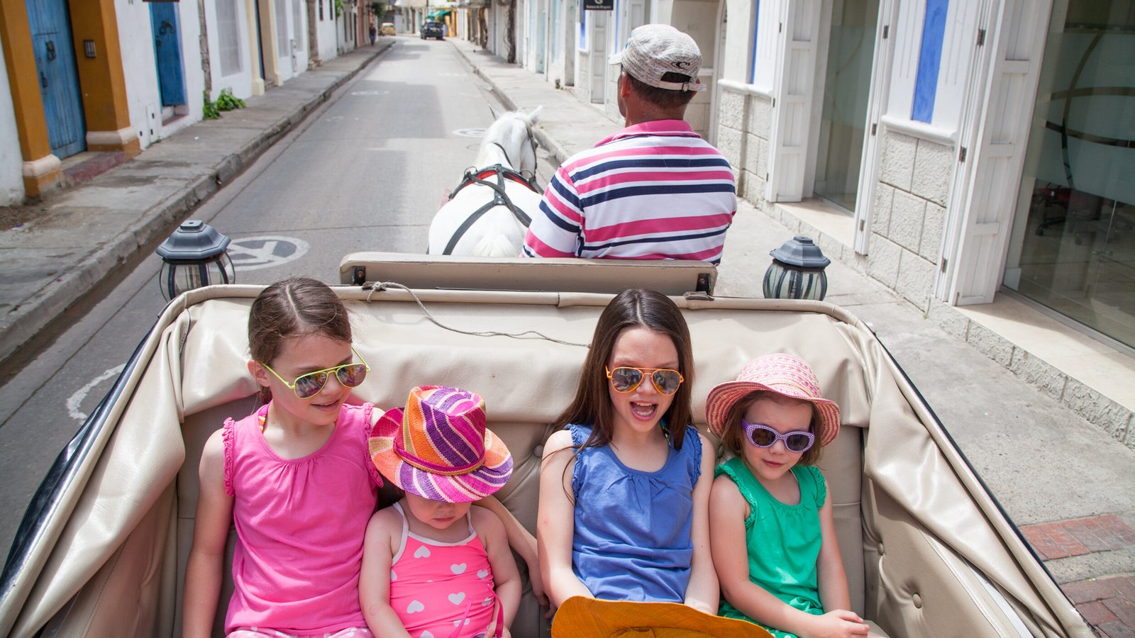 LANDED-Travel-Family in the back of a horse pulled car - Colombia-Cartagena